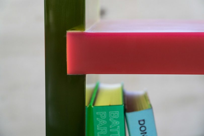 acrylic yellow and red bookshelves