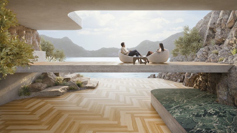 outdoor space with two seated people on a deck overlooking water and mountains