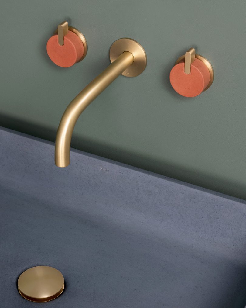 brushed brass and orange tap installed