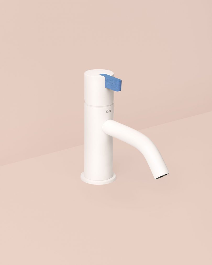 white and blue monobloc tap on light pink background