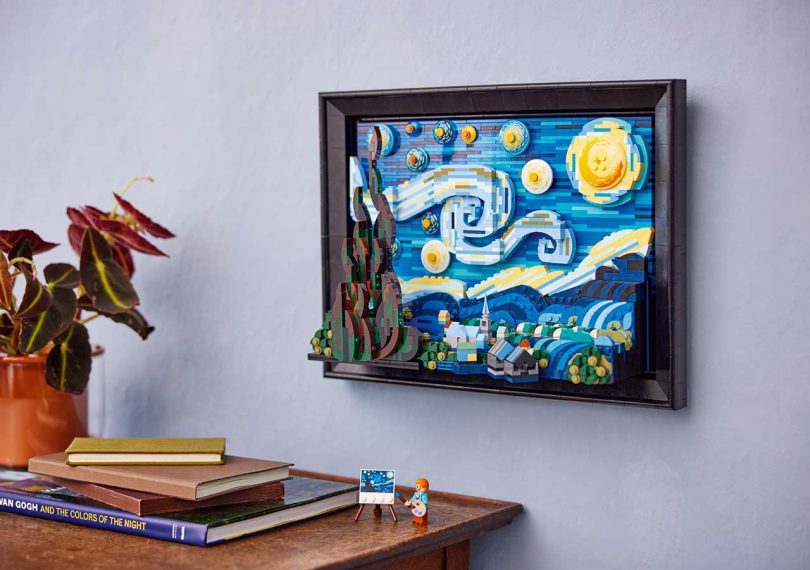 A LEGO interpretation of Van Gogh's Starry Night hanging on a wall