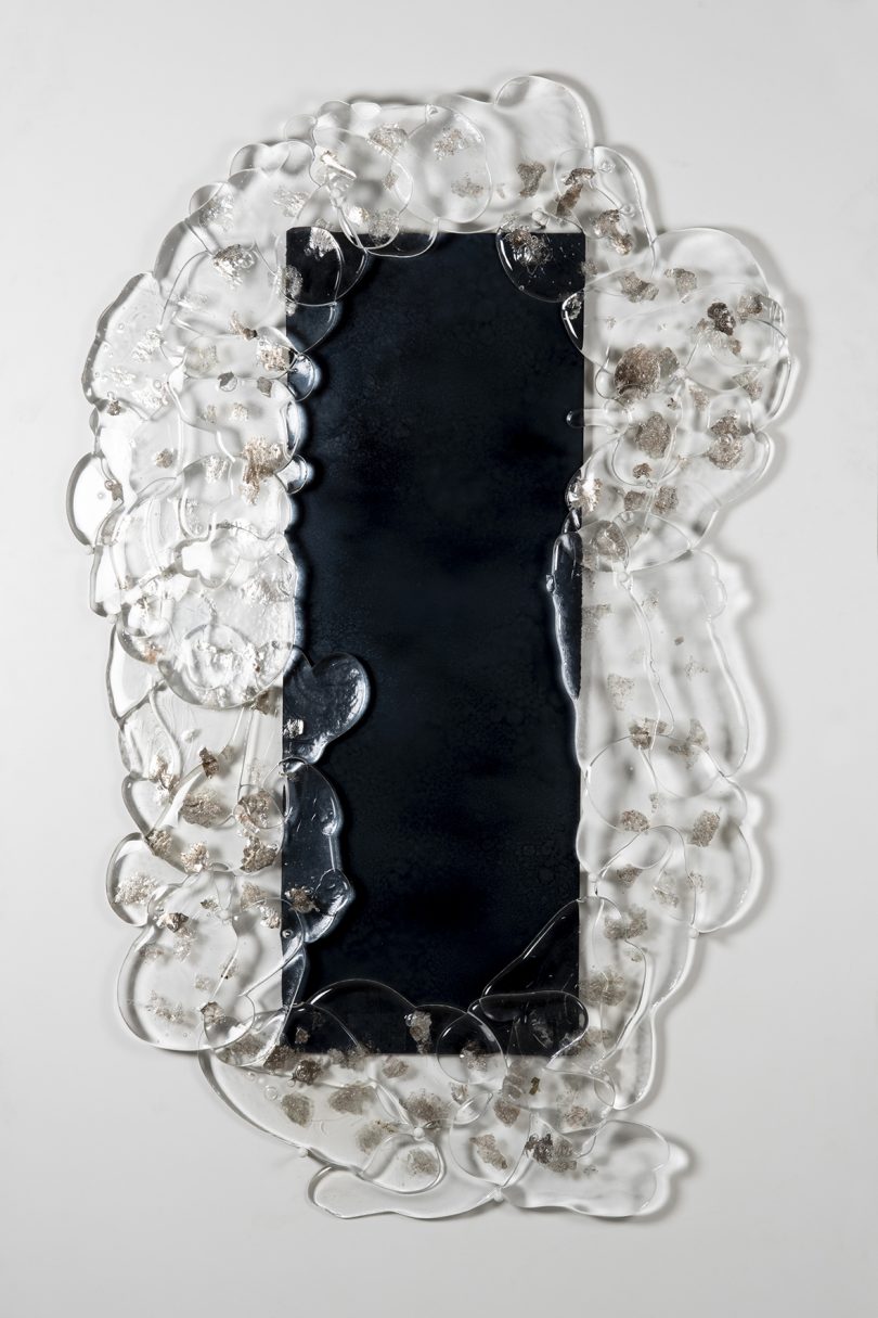 mirror framed in clear molten glass
