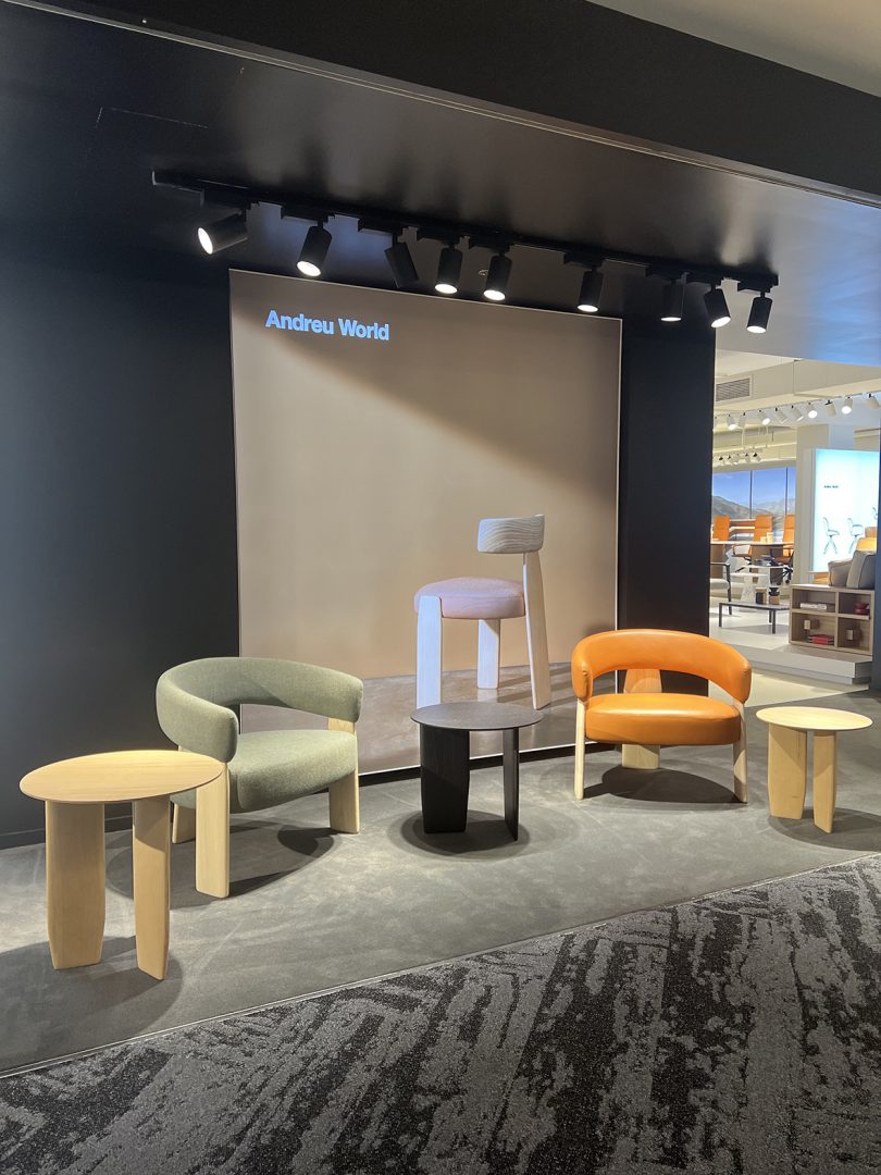 five pieces of furniture sit in the hallway in front of a showroom