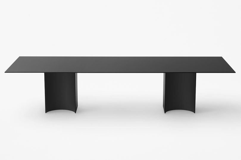 rectangular black dining table on white background
