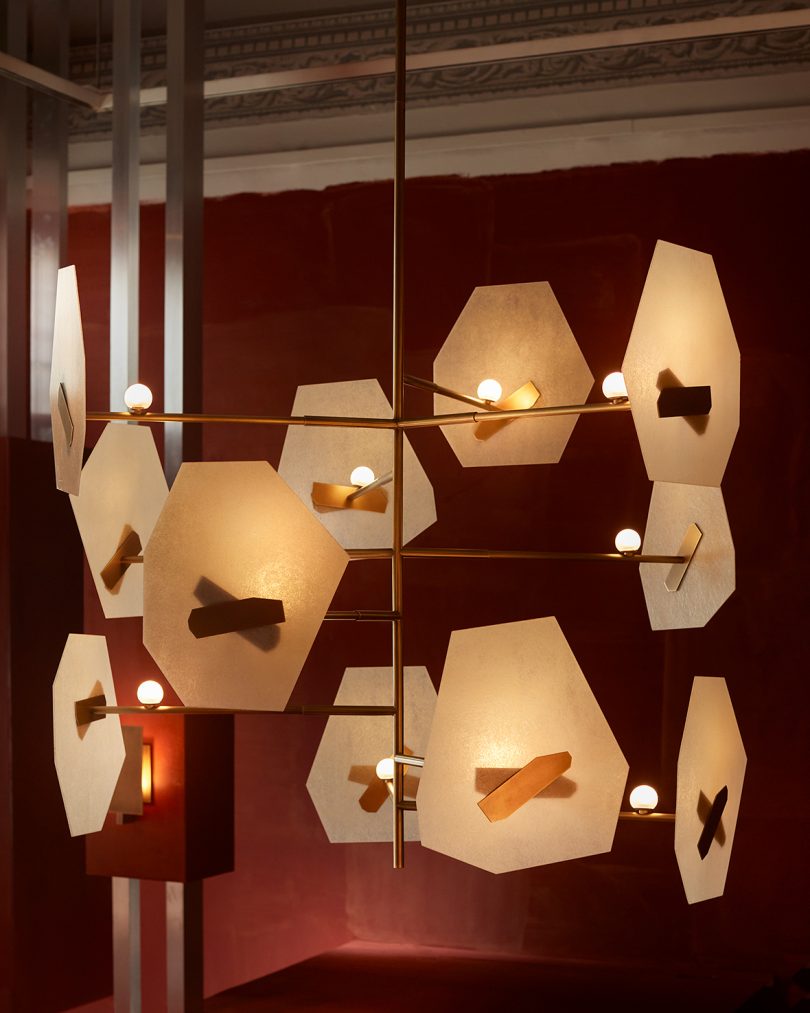 pendant lighting in styled room with dark rust walls