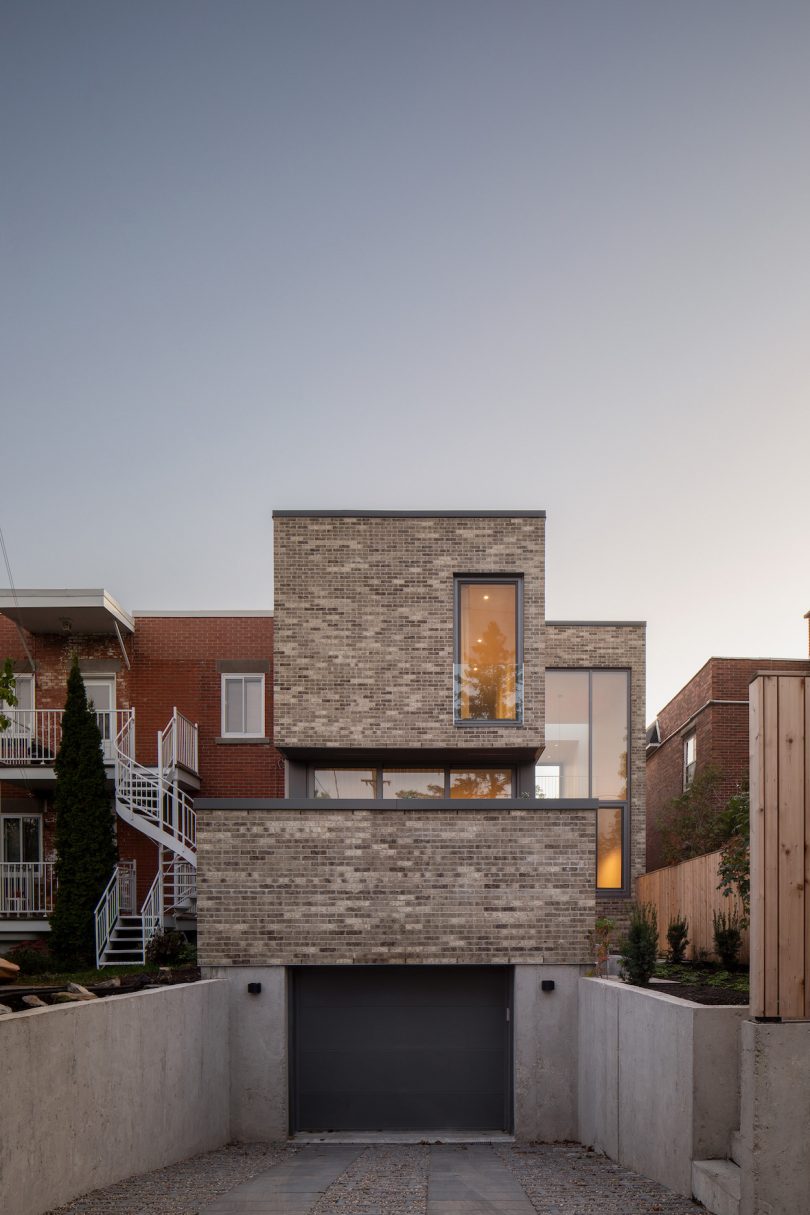 A low brick wall provides privacy while allowing natural light to enter the space