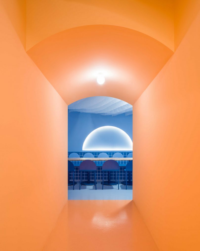 modern restaurant interior featuring blue and peach tones