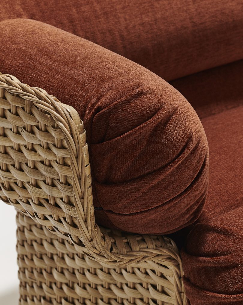 detail of modern rattan sofa in front of white wall