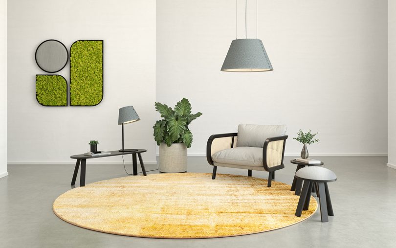 seating area with large round yellow rug