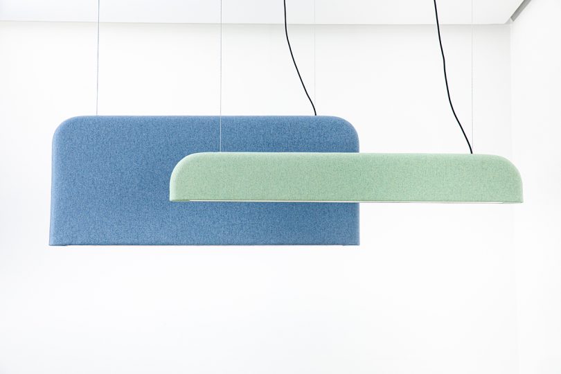 two felt hanging light fixtures in blue and green
