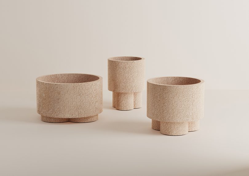 three cylindrical earth-colored vases