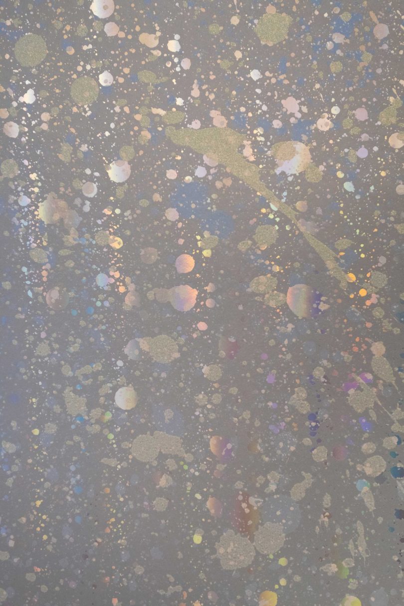 interior closeup view of metallic splattered wallpaper in holographic wallpaper