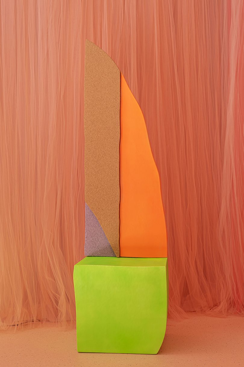 neon colored form against a peach colored background