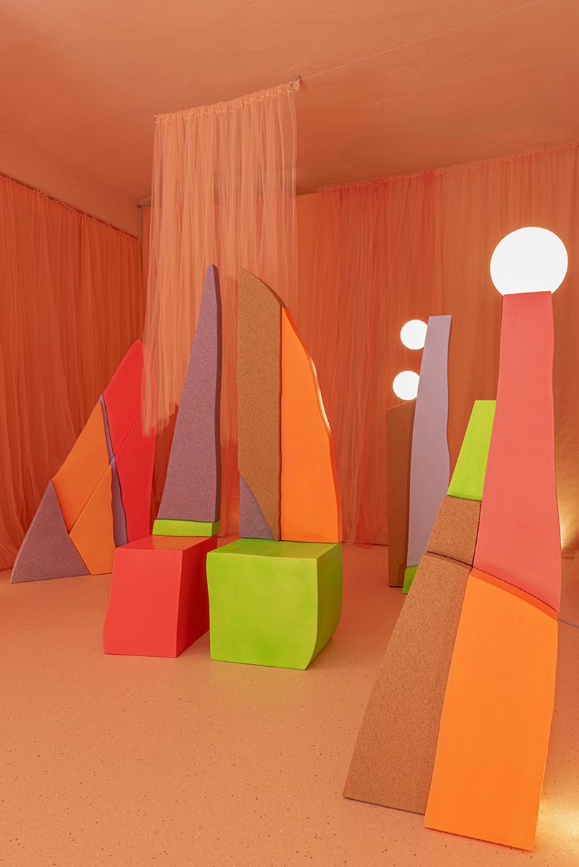 exhibition featuring neon colored forms and textures