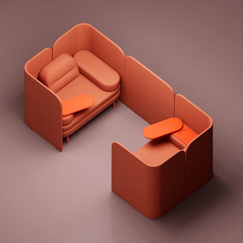 coral colored modular office furniture against a matching background