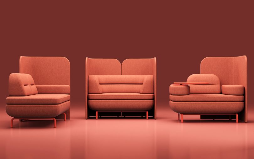 coral colored modular office furniture against a matching background
