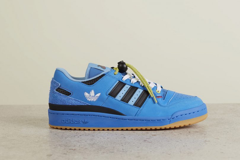 a bright blue adidas sneaker with black details