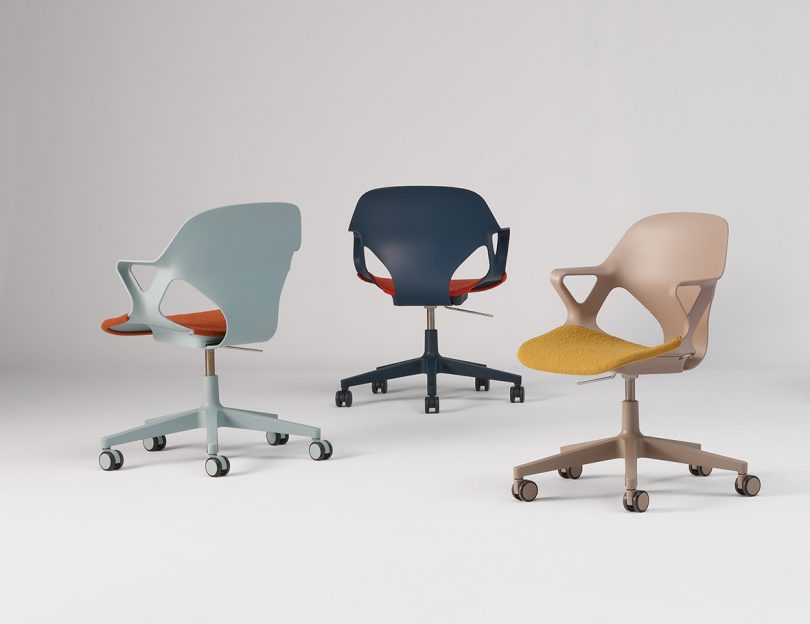 Three Zeph chairs with caster wheels staged against white background, in light blue dark blue and yellow/tan colors.