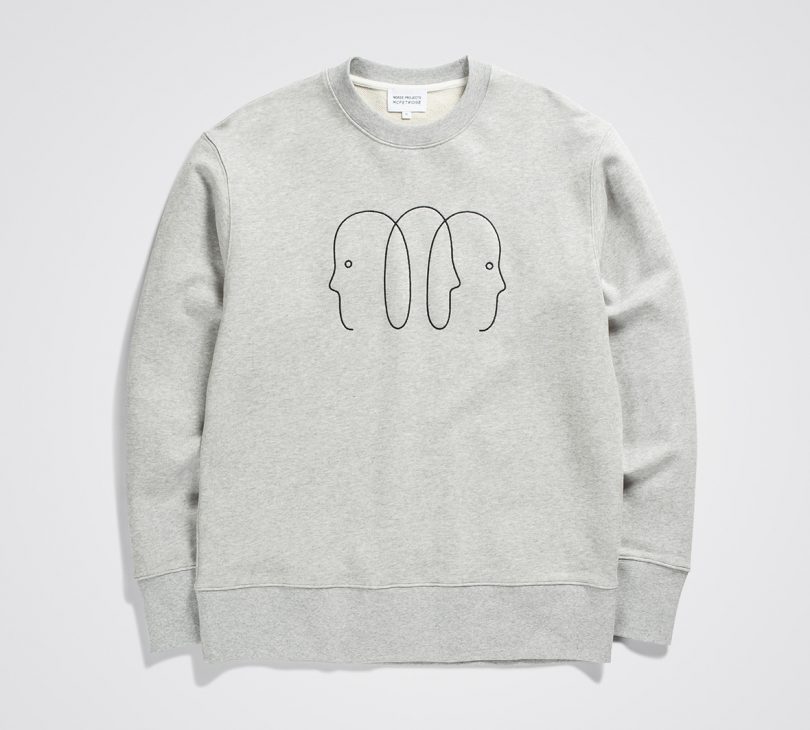 light grey sweatshirt laid flat with thin black line doodle