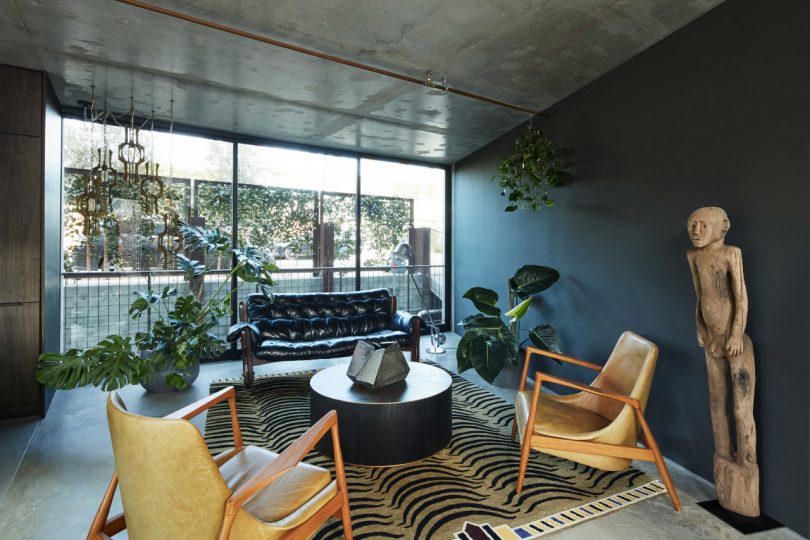 interior of modern home's seating area with modern and eclectic furnishings and large window