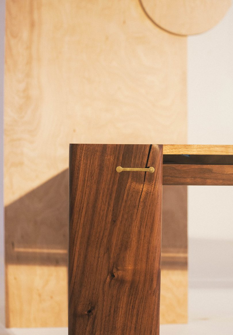 detail of rectangular four legs dark wood table