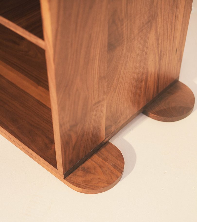 detail of long and low dark wood cabinet