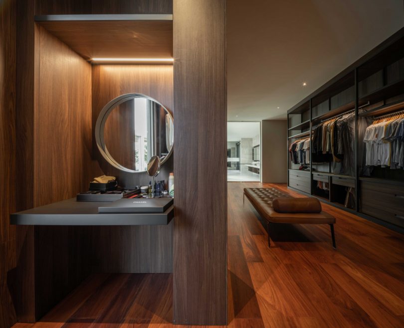 interior shot of large modern closet and dressing area with wood accents