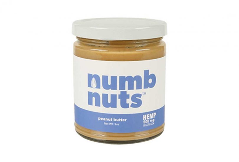 Jar of numb nuts peanut butter with pink and lavender label