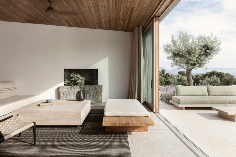 interior view split with modern living room and outside patio