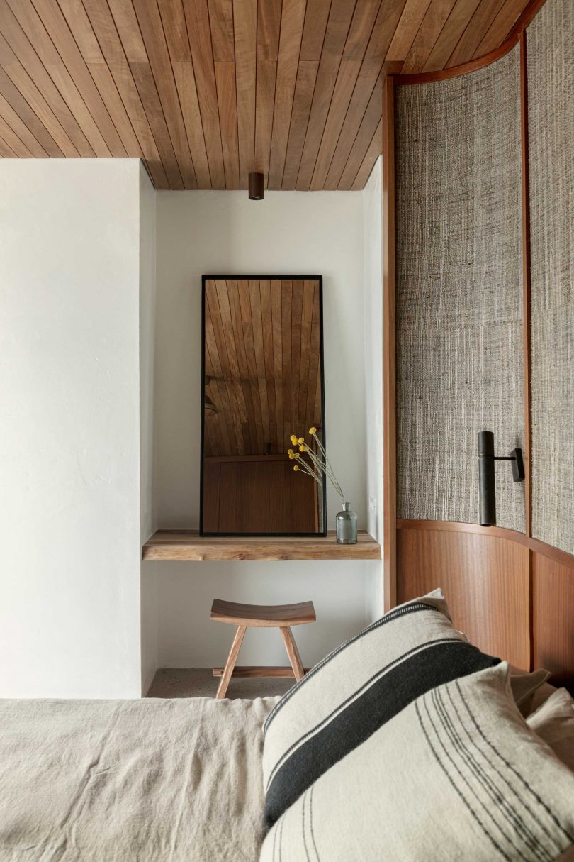 modern bedroom view with natural and neutral tones and materials