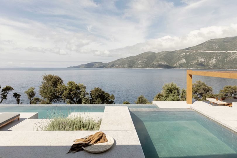 A Modern Greek Villa Built Into the Cliffside Overlooking the Sea