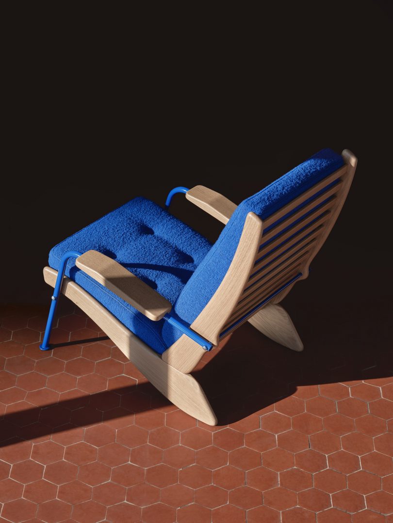 blue wood and steel lounge chair