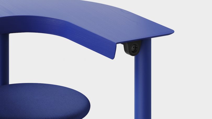 blue swivel arm chair upclose