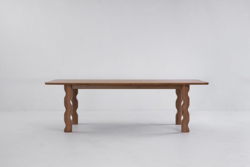 Front shot of the 98" Wave Dining Table as part of the Twin Tables Collection