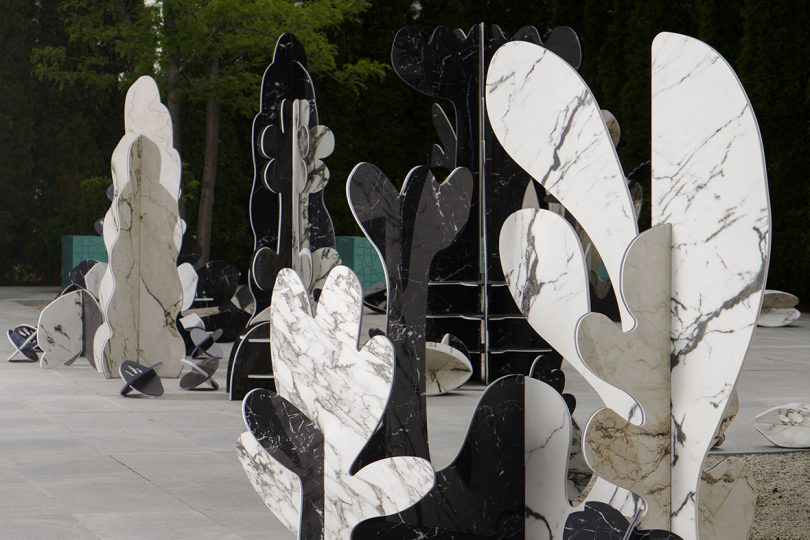 black, white, and grey marble sculptures that resemble a garden