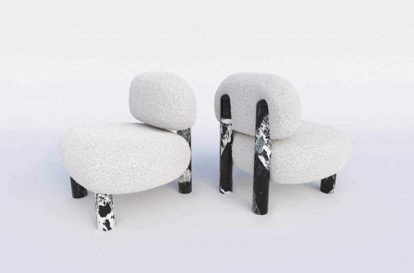 two upholstered chairs with marble legs on white background