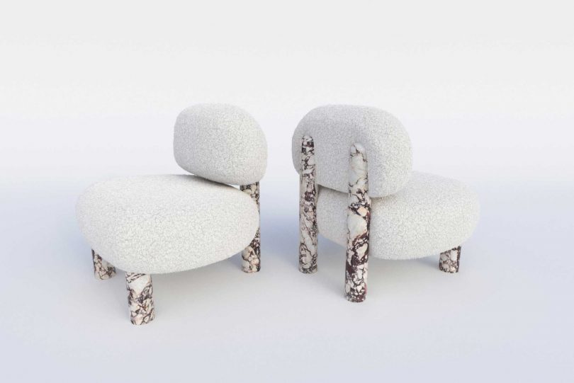 two upholstered chairs with marble legs on white background