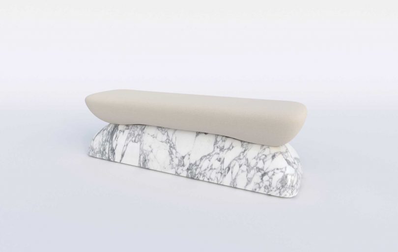 upholstered bench with a marble base on a white background