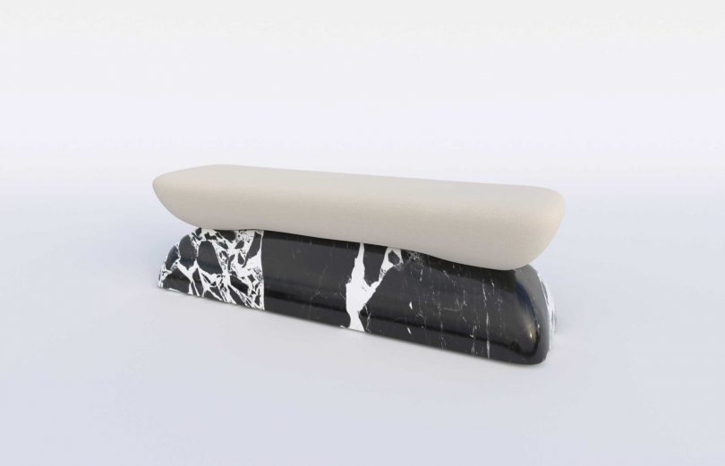 Upholstered bench seat with marble base on white background