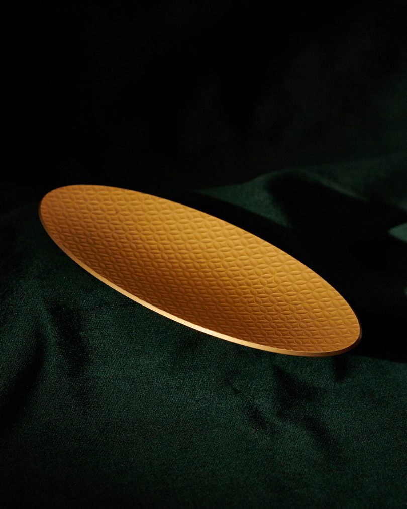 oval gold colored rolling tray