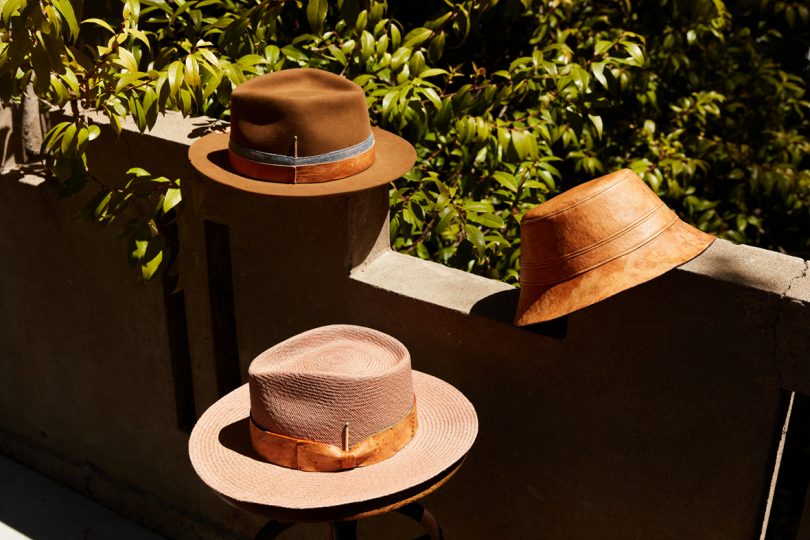 three brown hats sitting on a patio outdoors