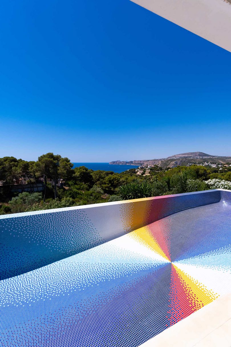angled view of empty colorful mosaic swimming pool
