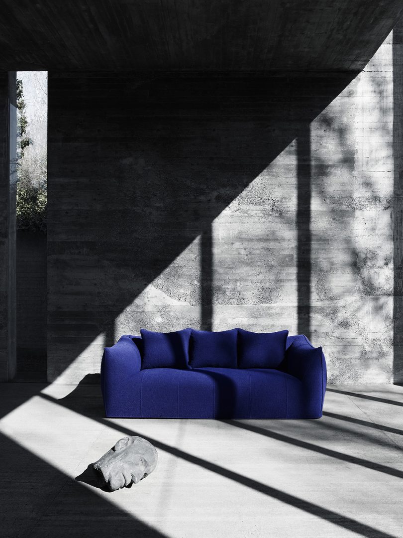 blue 2-seater sofa in shadows