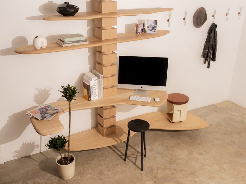 modular wood shelving styled as an office