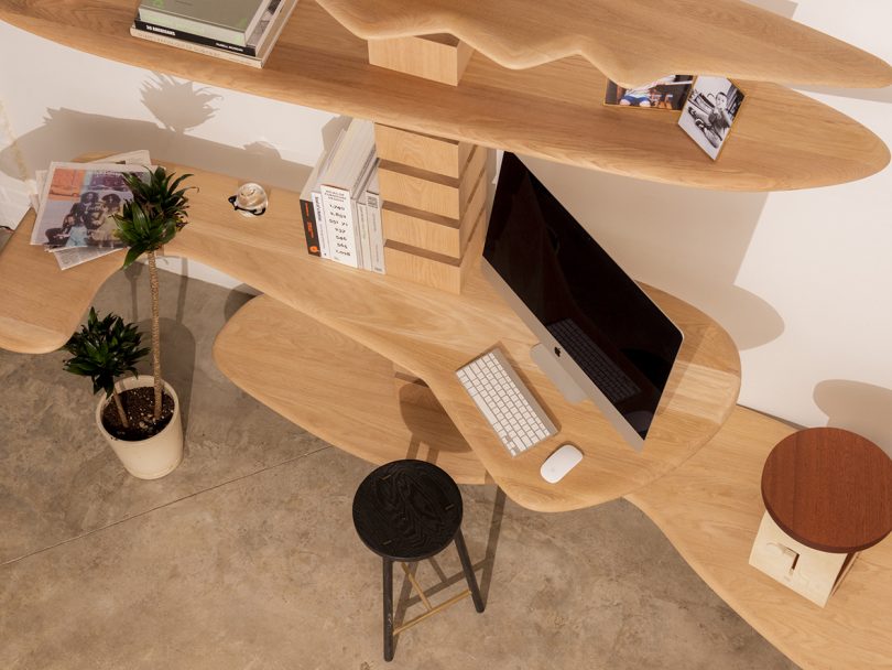 modular wood shelving styled as an office
