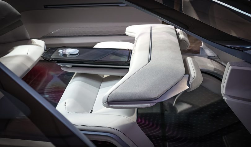 interior of Lincoln concept car with view of the interactive center console, one that forgoes the steering wheel for a chess piece controller.