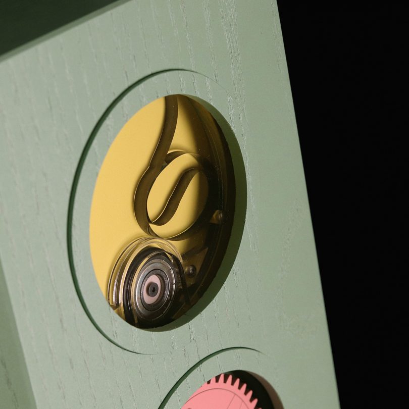 Detail view of Doodlestation yellow circular opening located in lime green tower cabinet.