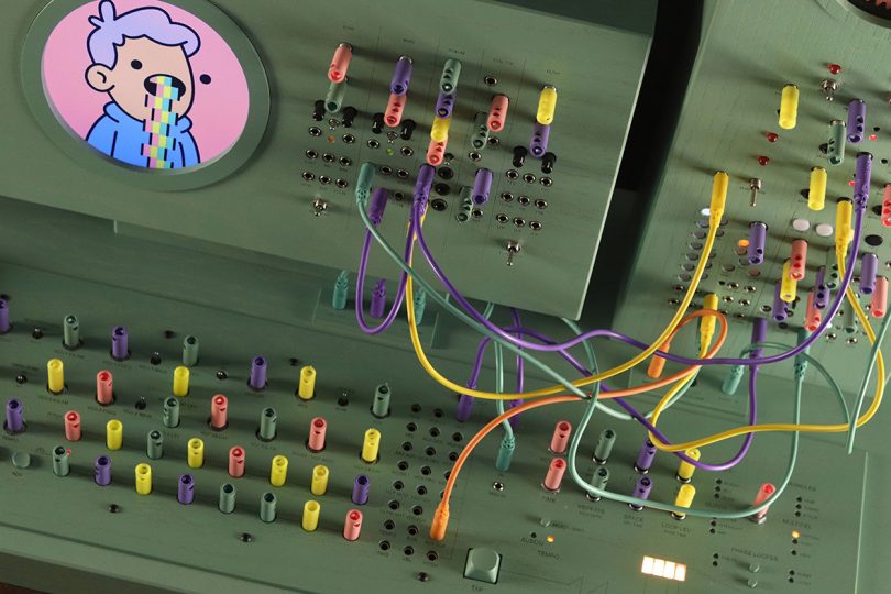 Detail view of Doodlestation's multi-colored sequencer wires and small dials.