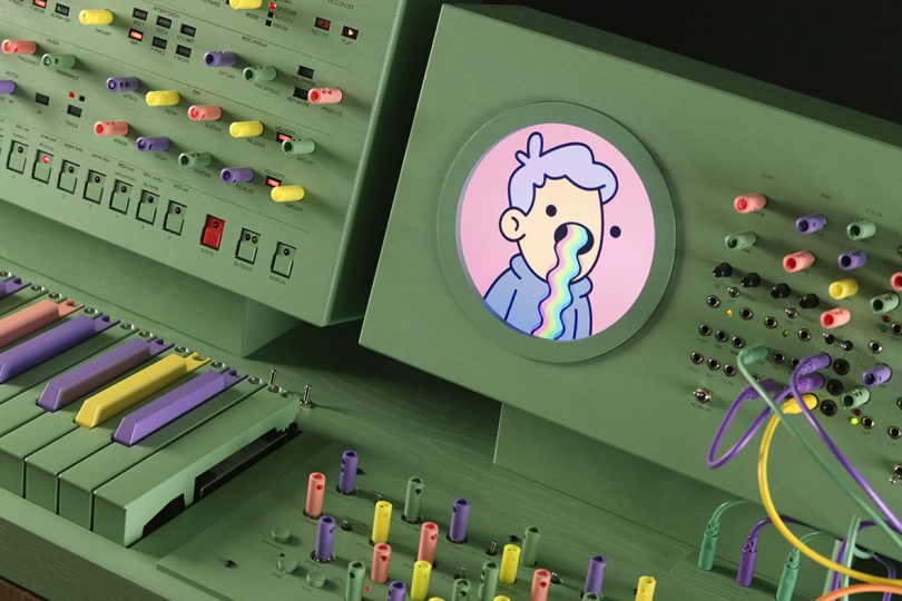 Detail of screen displays with cartoon character vomiting a rainbow.