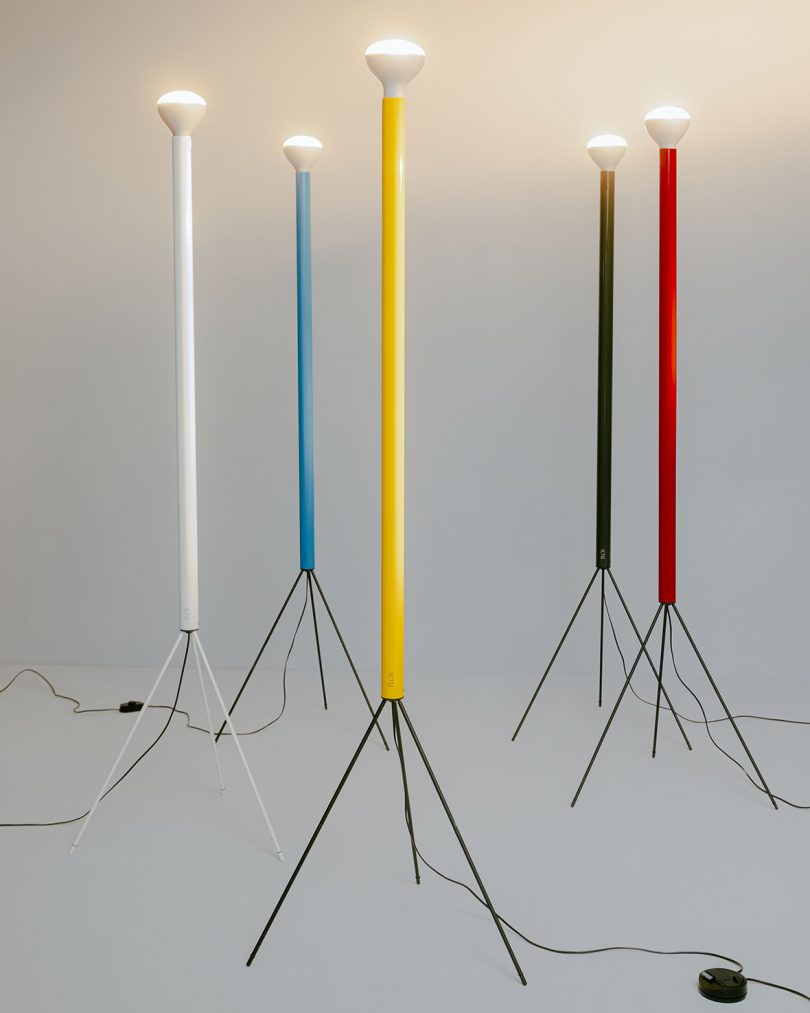 white, blue, yellow, black, and red slim tripod floor lamps